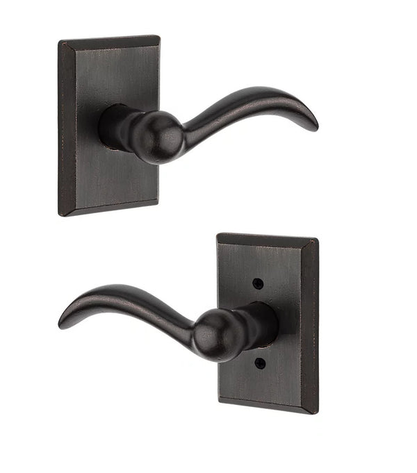 The Baldwin Reserve Arch Lever with Rustic Square Rosette in Dark Bronze finish.