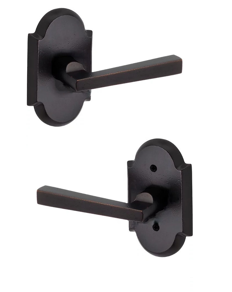 The Baldwin Reserve Taper Lever with Rustic Arch Rosette in Dark Bronze finish.