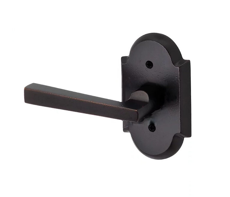The Baldwin Reserve Taper Lever with Rustic Arch Rosette in Dark Bronze finish.