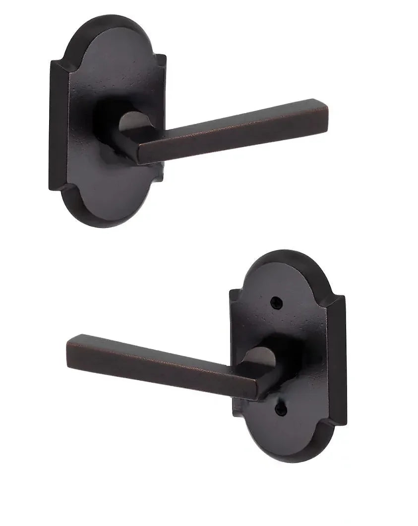 The Baldwin Reserve Taper Lever with Rustic Arch Rosette in Dark Bronze finish.