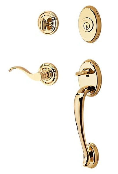 The Baldwin Reserve Columbus Handleset with Interior Curve Lever with Traditional Round Rosette in Lifetime Polished Brass finish.