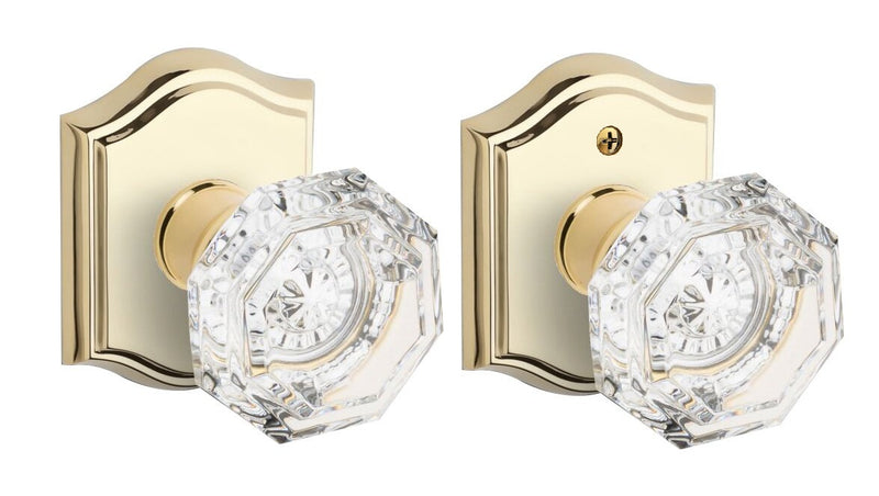 The Baldwin Reserve Crystal Knob with Traditional Arch Rosette in Lifetime Polished Brass finish.