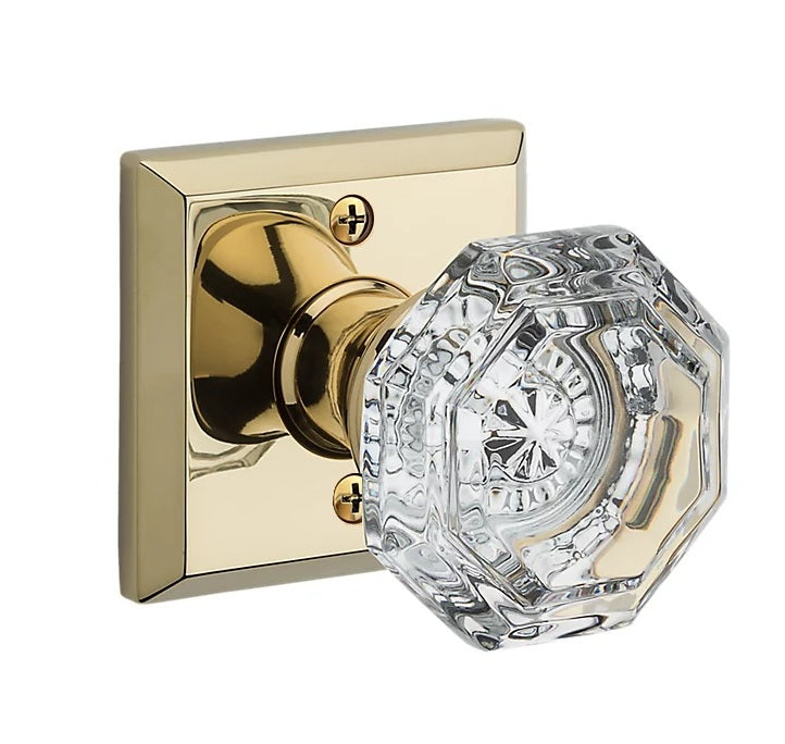 The Baldwin Reserve Crystal Knob with Traditional Square Rosette in Lifetime Polished Brass finish.