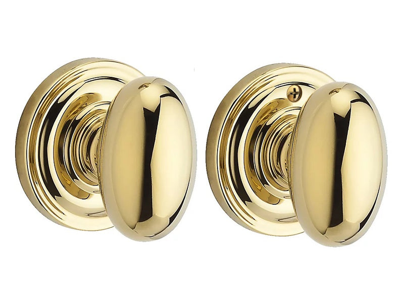 The Baldwin Reserve Ellipse Knob with Traditional Round Rosette in Lifetime Polished Brass finish.