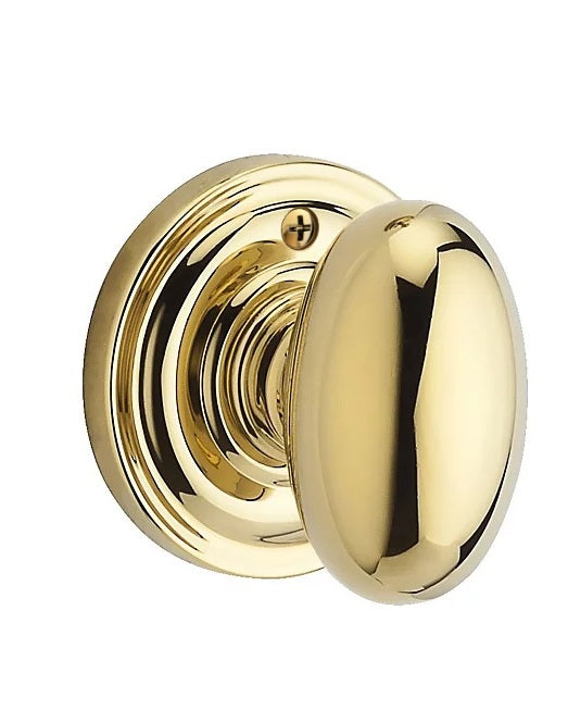 The Baldwin Reserve Ellipse Knob with Traditional Round Rosette in Lifetime Polished Brass finish.