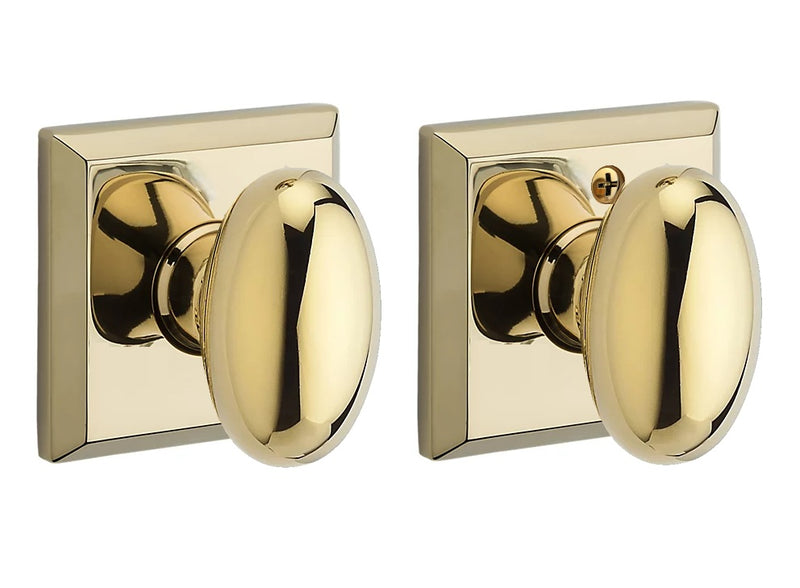 The Baldwin Reserve Ellipse Knob with Traditional Square Rosette in Lifetime Polished Brass finish.