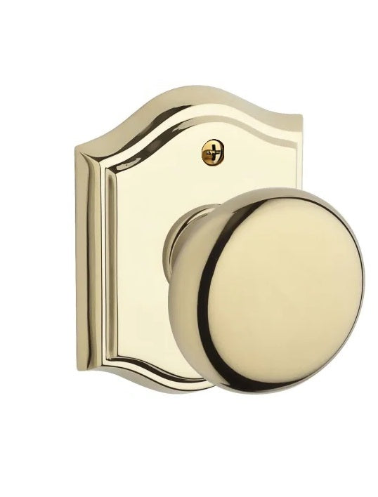 The Baldwin Reserve Round Knob with Traditional Arch Rosette in Lifetime Polished Brass finish.