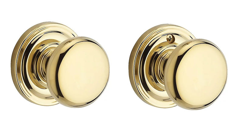 The Baldwin Reserve Round Knob with Traditional Round Rosette in Lifetime Polished Brass finish.