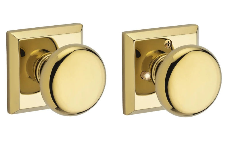 The Baldwin Reserve Round Knob with Traditional Square Rosette in Lifetime Polished Brass finish.