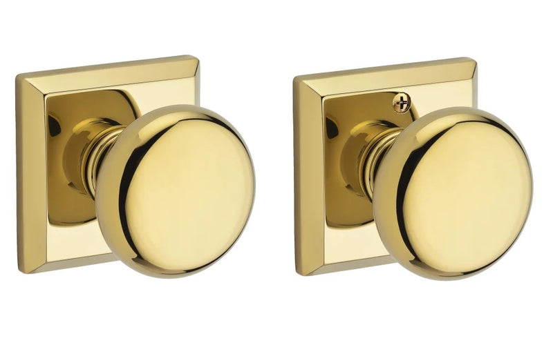 The Baldwin Reserve Round Knob with Traditional Square Rosette in Lifetime Polished Brass finish.