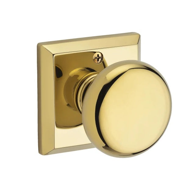 The Baldwin Reserve Round Knob with Traditional Square Rosette in Lifetime Polished Brass finish.