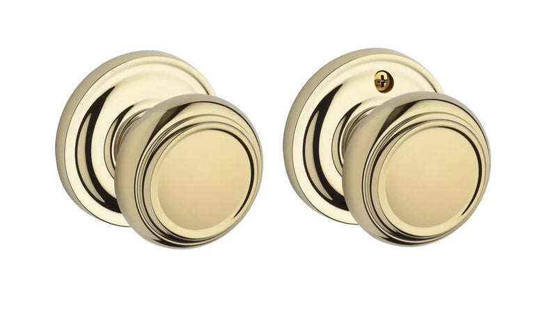 The Baldwin Reserve Traditional Knob with Traditional Round Rosette in Lifetime Polished Brass finish.