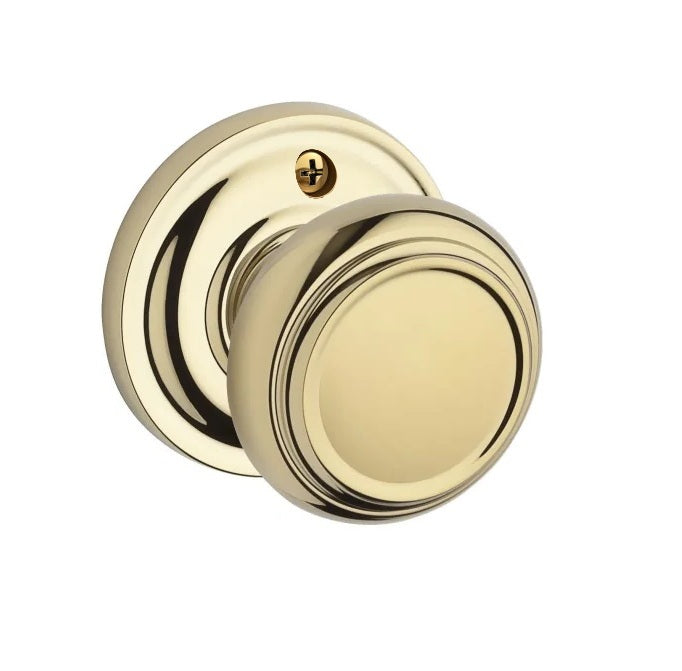 The Baldwin Reserve Traditional Knob with Traditional Round Rosette in Lifetime Polished Brass finish.