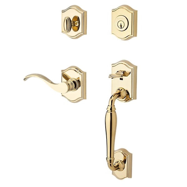 The Baldwin Reserve Westcliff Handleset with Interior Curve Lever with Traditional Arch Rosette in Lifetime Polished Brass finish.