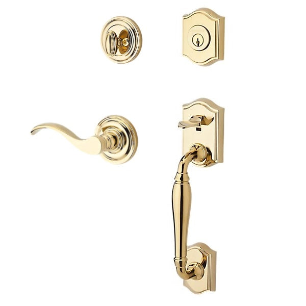 The Baldwin Reserve Westcliff Handleset with Interior Curve Lever with Traditional Round Rosette in Lifetime Polished Brass finish.