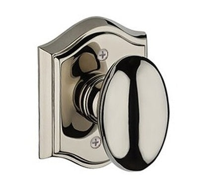 The Baldwin Reserve Ellipse Knob with Traditional Arch Rosette in Lifetime Polished Nickel finish.