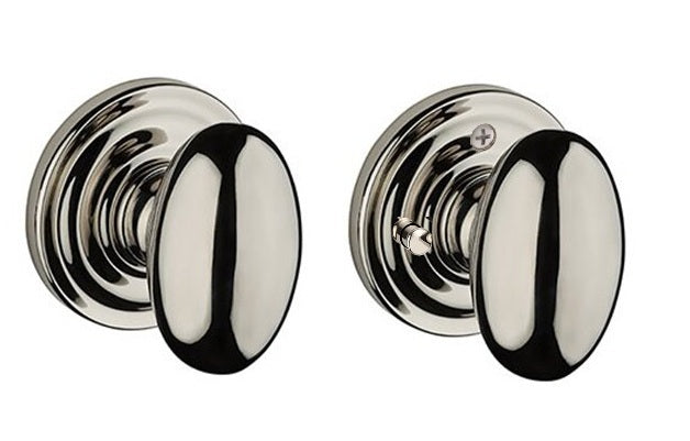 The Baldwin Reserve Ellipse Knob with Traditional Round Rosette in Lifetime Polished Nickel finish.