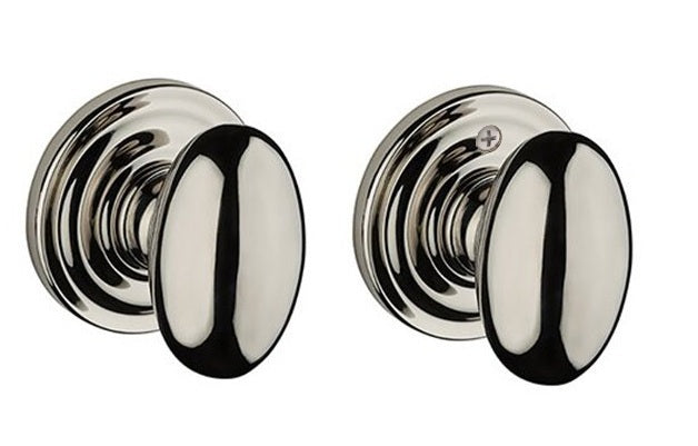 The Baldwin Reserve Ellipse Knob with Traditional Round Rosette in Lifetime Polished Nickel finish.