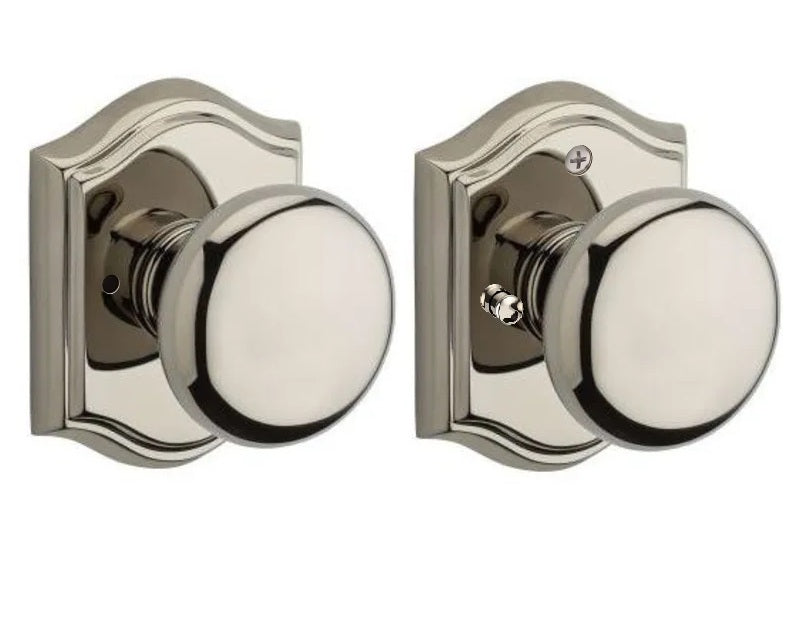 The Baldwin Reserve Round Knob with Traditional Arch Rosette in Lifetime Polished Nickel finish.