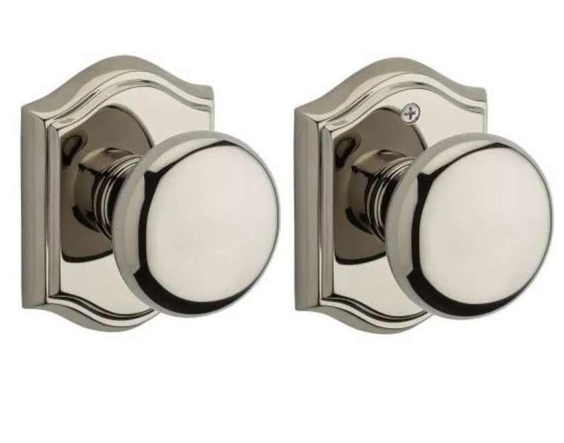 The Baldwin Reserve Round Knob with Traditional Arch Rosette in Lifetime Polished Nickel finish.