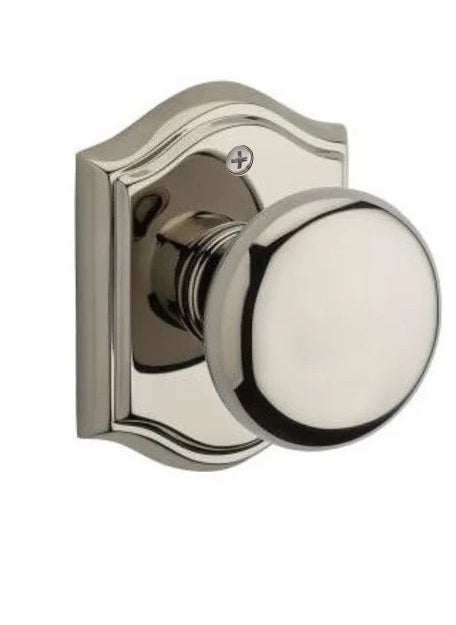 The Baldwin Reserve Round Knob with Traditional Arch Rosette in Lifetime Polished Nickel finish.