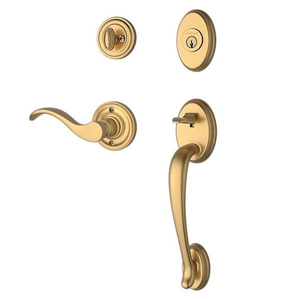 The Baldwin Reserve Columbus Handleset with Interior Curve Lever with Traditional Round Rosette in Lifetime Satin Brass finish.