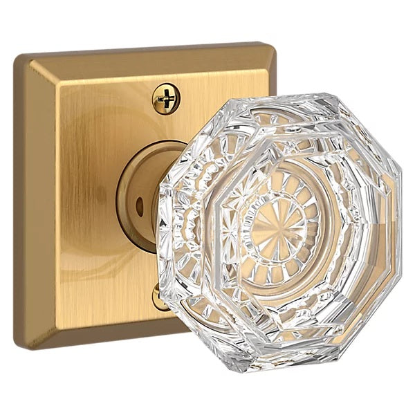 The Baldwin Reserve Crystal Knob with Traditional Square Rosette in Lifetime Satin Brass finish.