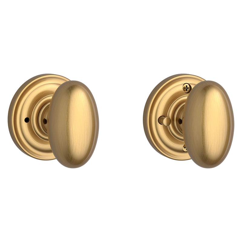The Baldwin Reserve Ellipse Knob with Traditional Round Rosette in Lifetime Satin Brass finish.