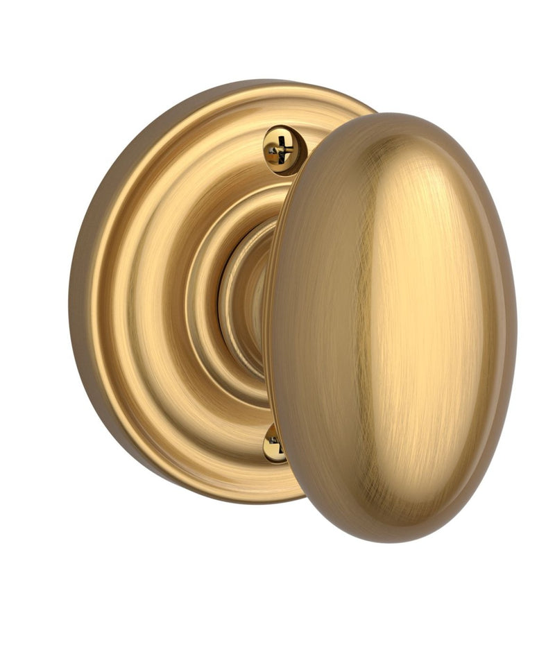 The Baldwin Reserve Ellipse Knob with Traditional Round Rosette in Lifetime Satin Brass finish.