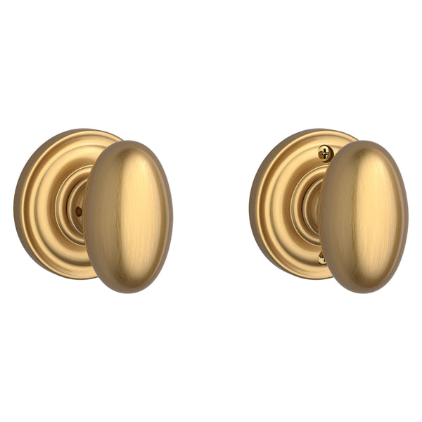 The Baldwin Reserve Ellipse Knob with Traditional Round Rosette in Lifetime Satin Brass finish.