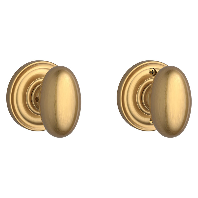 The Baldwin Reserve Ellipse Knob with Traditional Round Rosette in Lifetime Satin Brass finish.