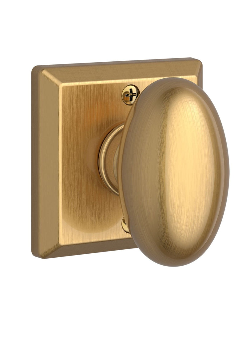 The Baldwin Reserve Ellipse Knob with Traditional Square Rosette in Lifetime Satin Brass finish.