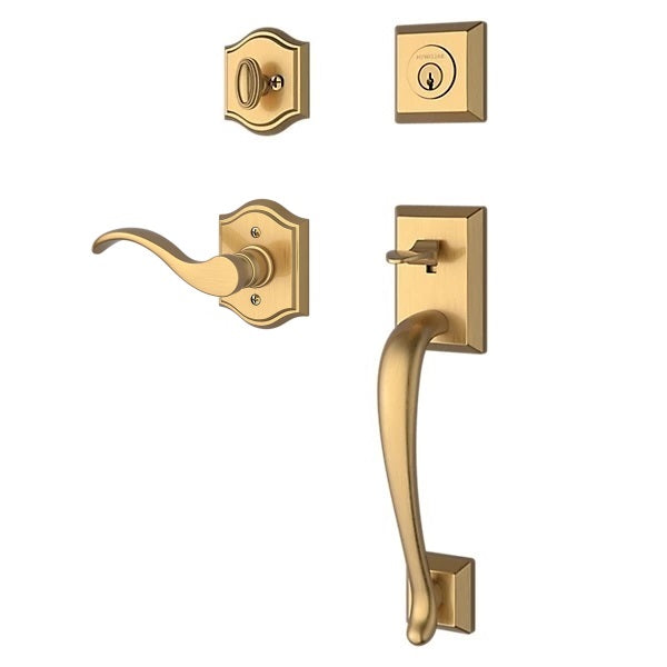 The Baldwin Reserve Napa Handleset with Interior Curve Lever with Traditional Arch Rosette in Lifetime Satin Brass finish.