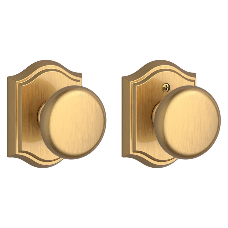 The Baldwin Reserve Round Knob with Traditional Arch Rosette in Lifetime Satin Brass finish.