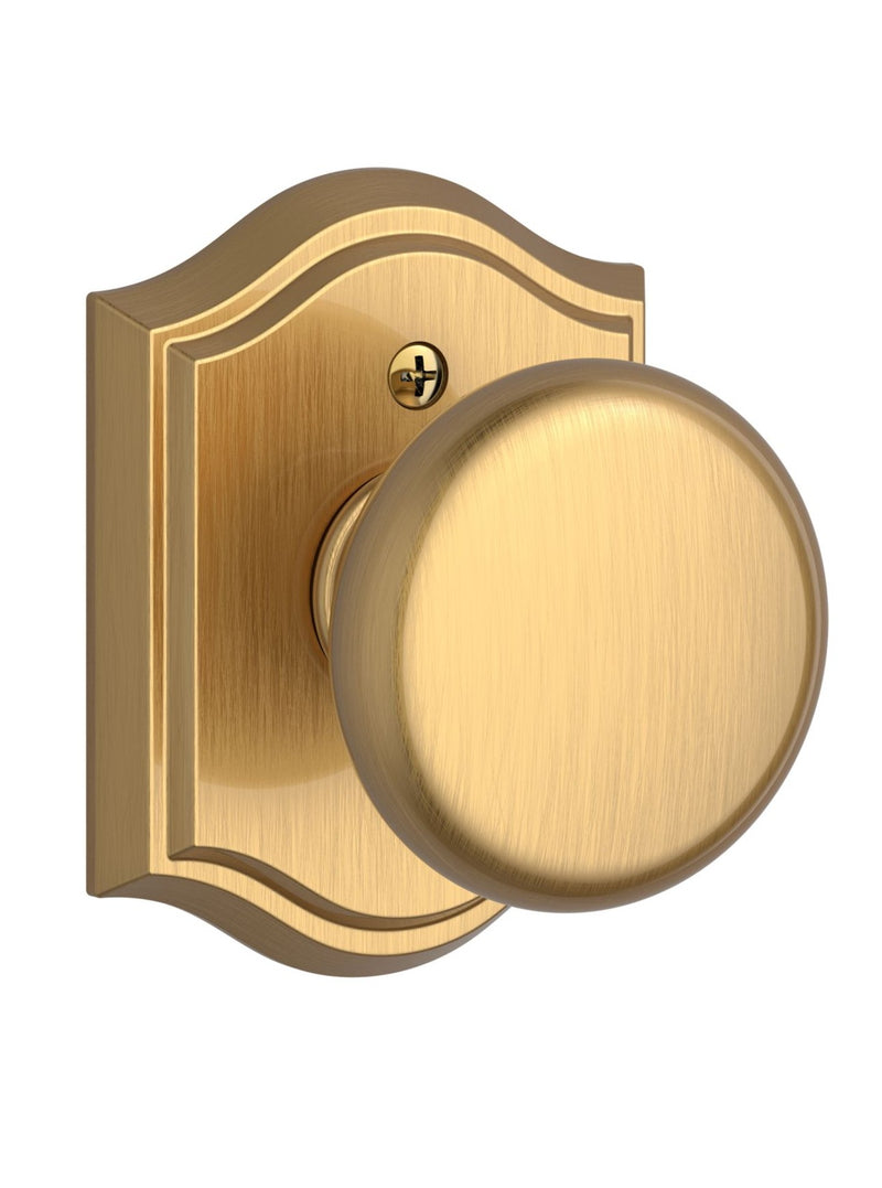 The Baldwin Reserve Round Knob with Traditional Arch Rosette in Lifetime Satin Brass finish.