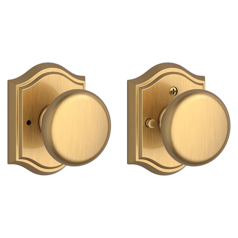 The Baldwin Reserve Round Knob with Traditional Arch Rosette in Lifetime Satin Brass finish.