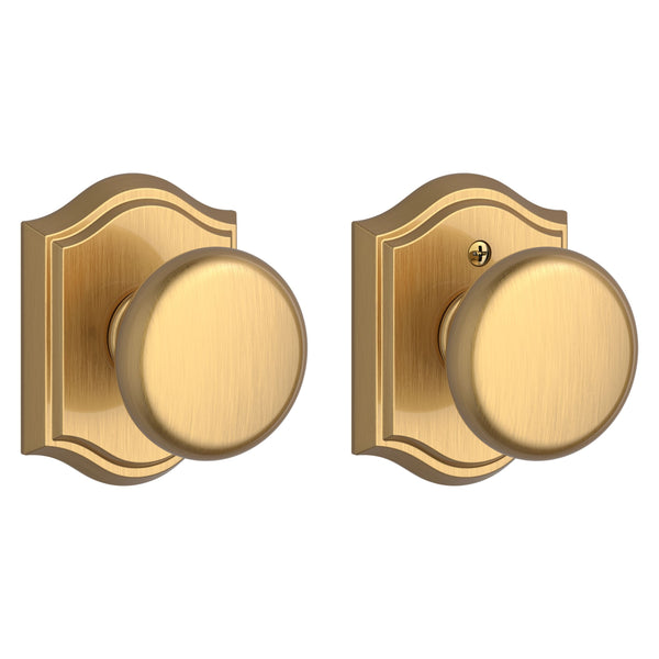 The Baldwin Reserve Round Knob with Traditional Arch Rosette in Lifetime Satin Brass finish.