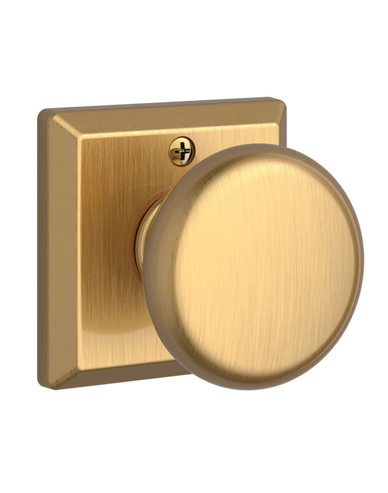 The Baldwin Reserve Round Knob with Traditional Square Rosette in Lifetime Satin Brass finish.