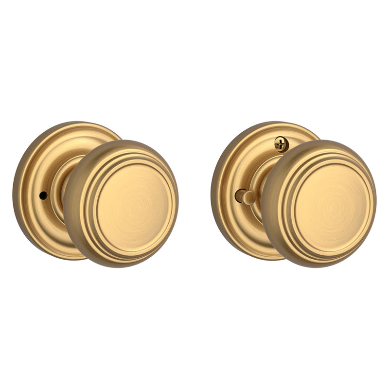 The Baldwin Reserve Traditional Knob with Traditional Round Rosette in Lifetime Satin Brass finish.