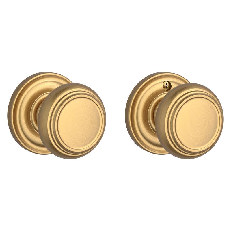 The Baldwin Reserve Traditional Knob with Traditional Round Rosette in Lifetime Satin Brass finish.