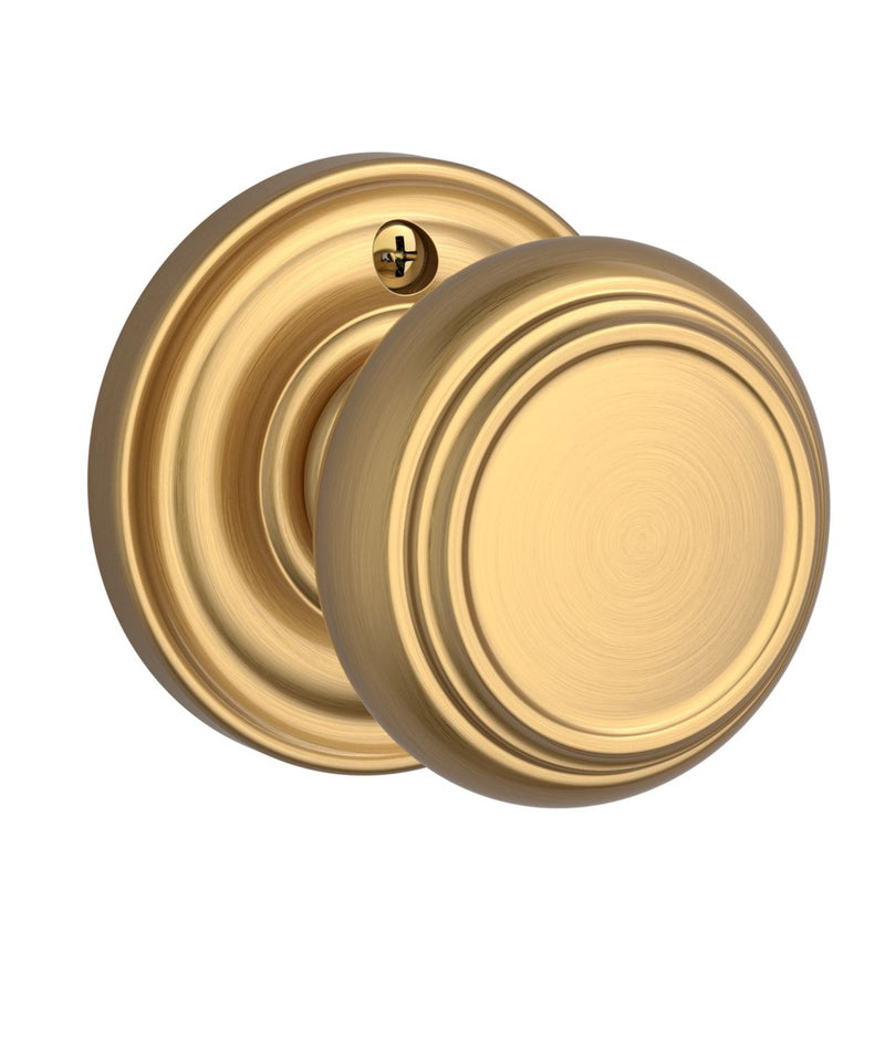 The Baldwin Reserve Traditional Knob with Traditional Round Rosette in Lifetime Satin Brass finish.