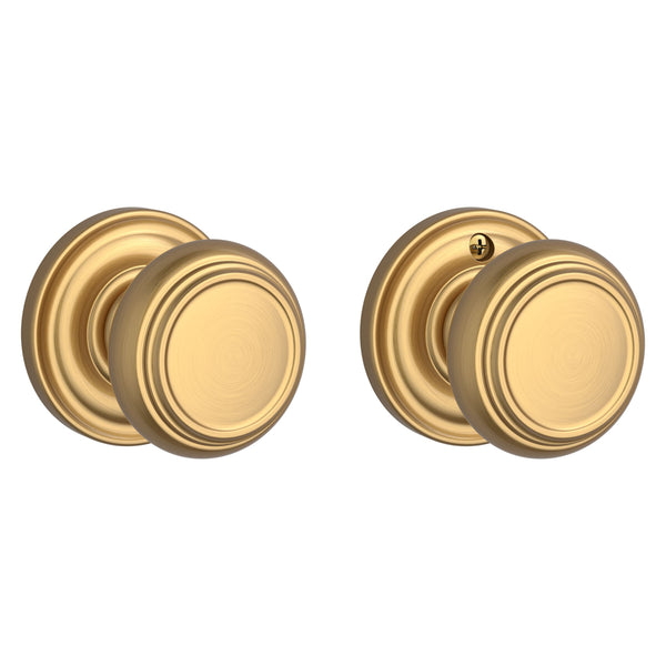 The Baldwin Reserve Traditional Knob with Traditional Round Rosette in Lifetime Satin Brass finish.
