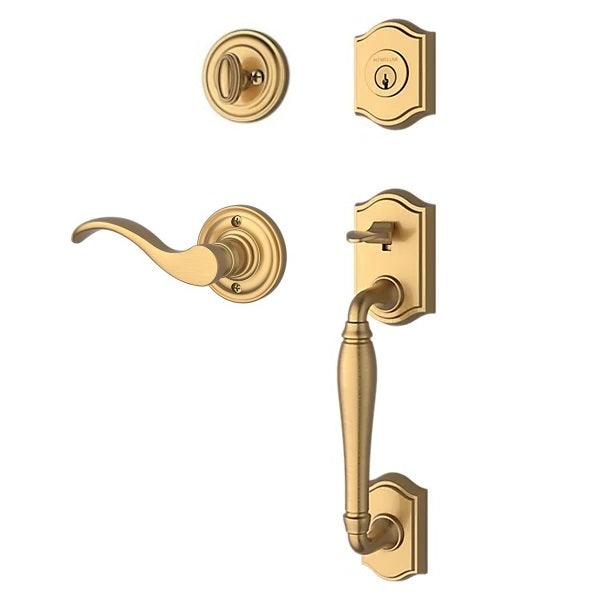 The Baldwin Reserve Westcliff Handleset with Interior Curve Lever with Traditional Round Rosette in Lifetime Satin Brass finish.