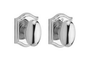 The Baldwin Reserve Ellipse Knob with Traditional Arch Rosette in Polished Chrome finish.