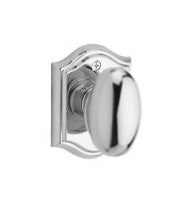 The Baldwin Reserve Ellipse Knob with Traditional Arch Rosette in Polished Chrome finish.