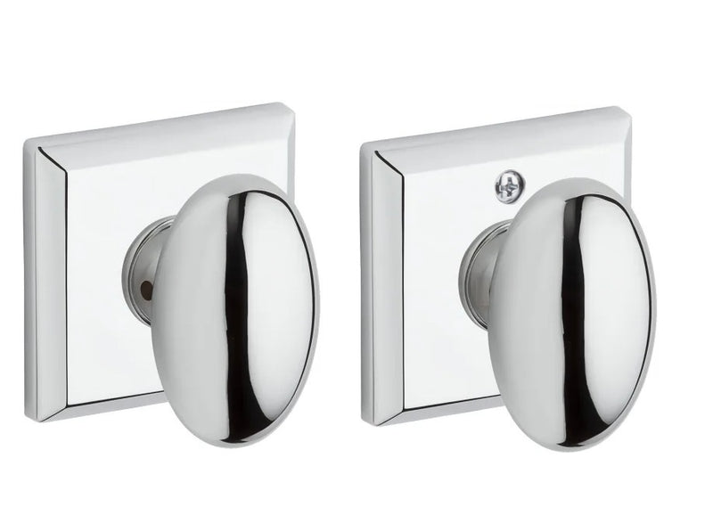 The Baldwin Reserve Ellipse Knob with Traditional Square Rosette in Polished Chrome finish.