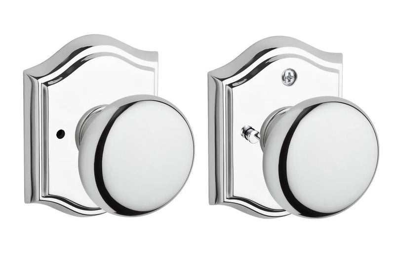 The Baldwin Reserve Round Knob with Traditional Arch Rosette in Polished Chrome finish.