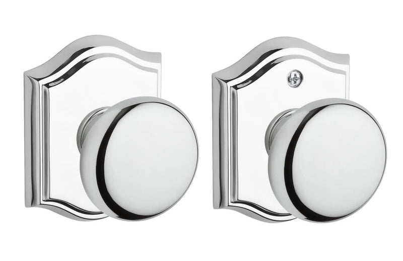 The Baldwin Reserve Round Knob with Traditional Arch Rosette in Polished Chrome finish.