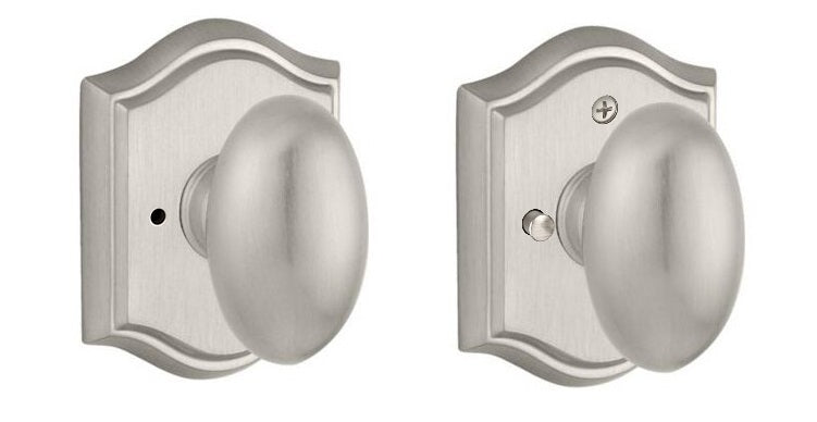 The Baldwin Reserve Ellipse Knob with Traditional Arch Rosette in Satin Nickel finish.
