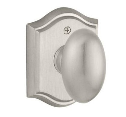 The Baldwin Reserve Ellipse Knob with Traditional Arch Rosette in Satin Nickel finish.
